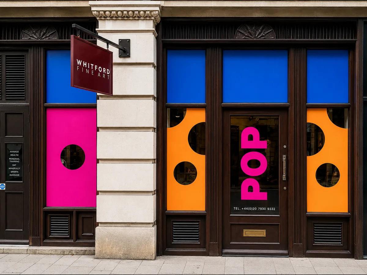 Bold colour-block cut vinyl panels with circle cut-outs across a London gallery shop front