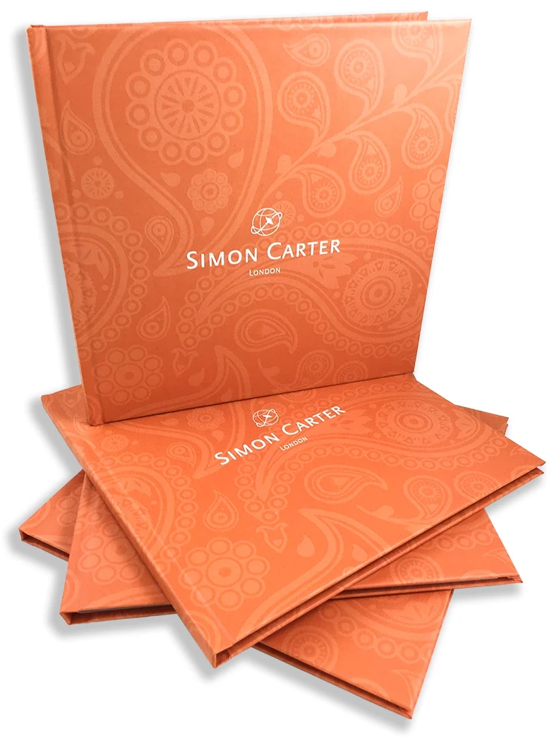 Case bound hardback books with printed paper-over-board covers in a fanned stack