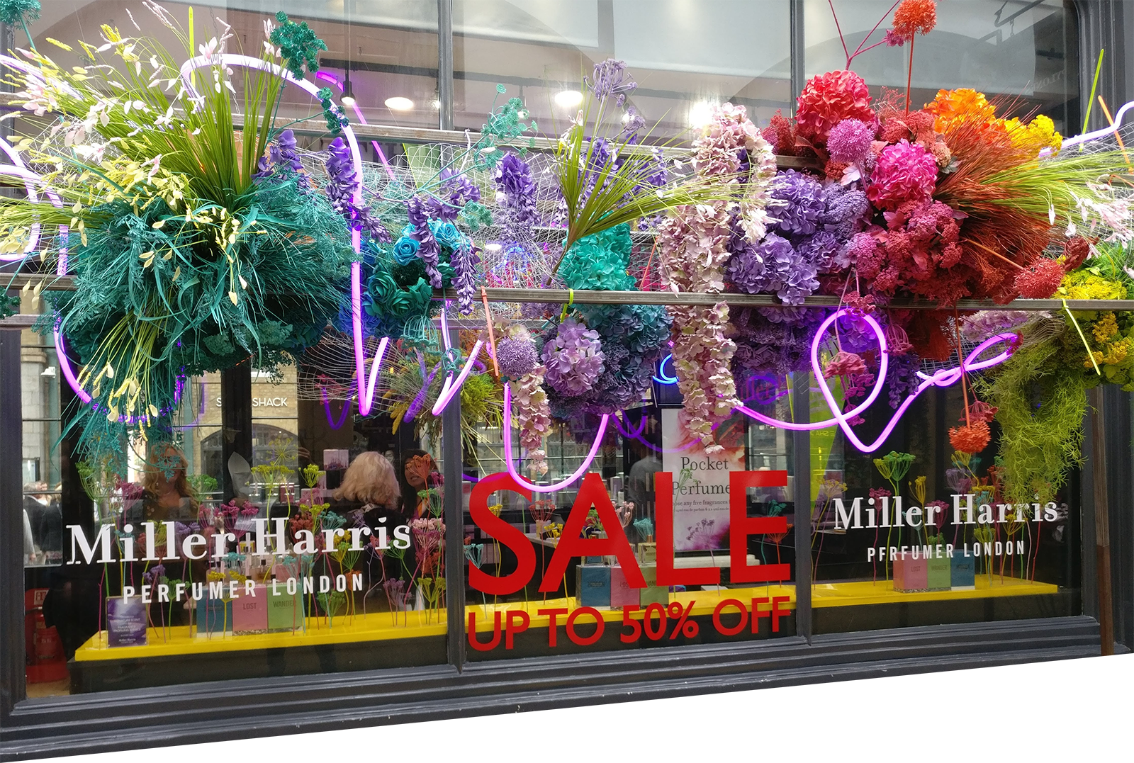 colourful retail window display with fret cut vinyl