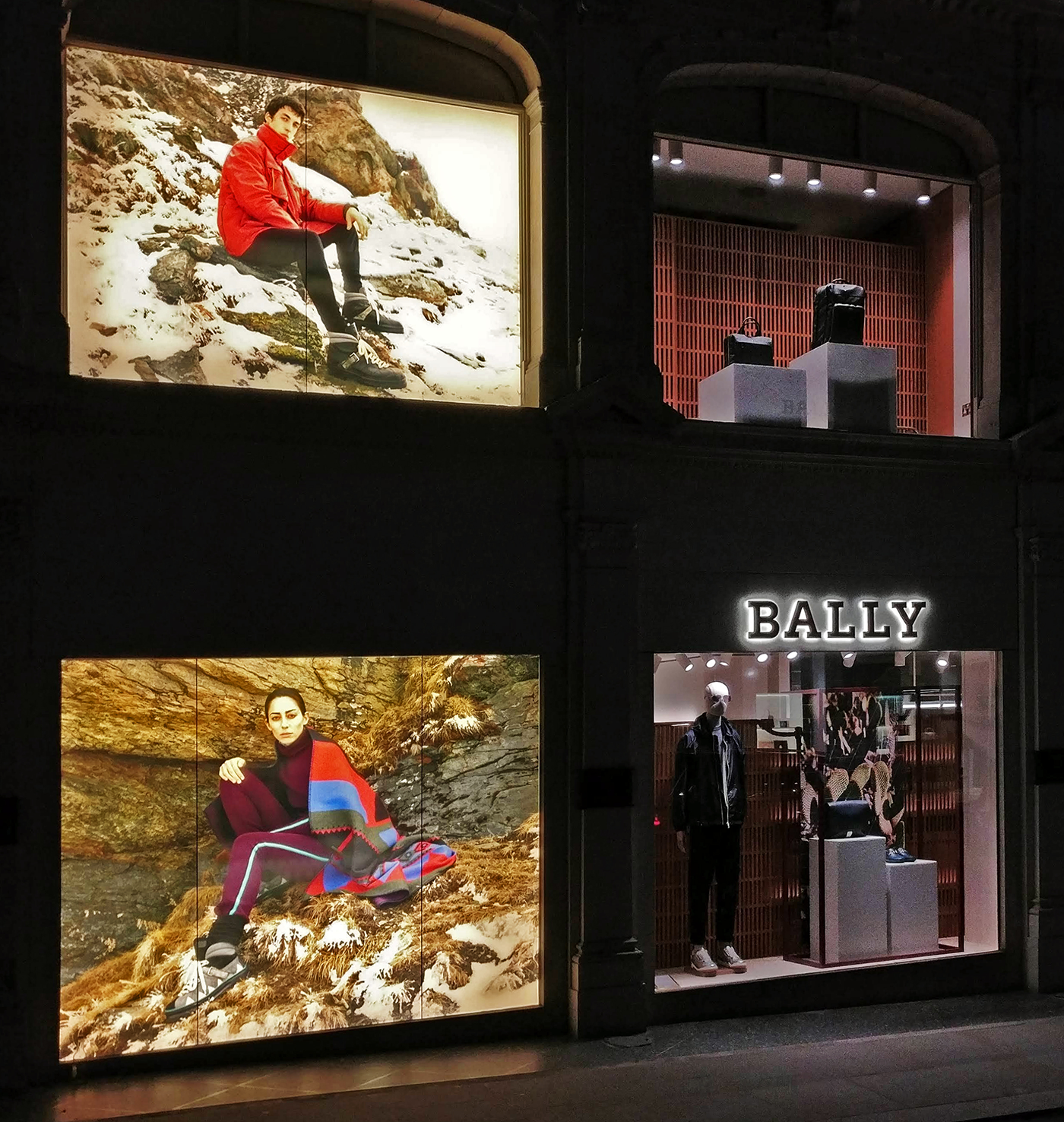 large lit up window display for upmarket retailer.