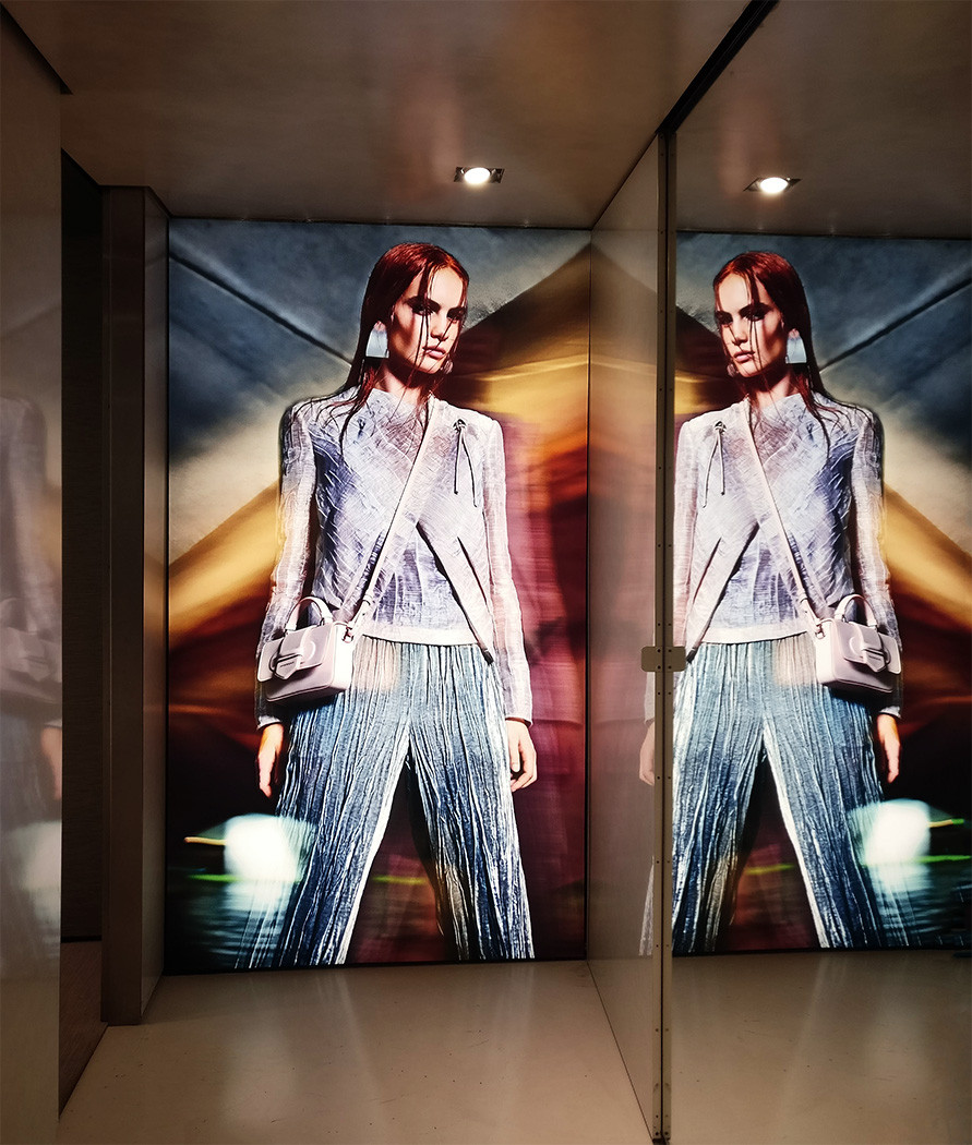 Tension fabric lightbox printed and installed in a mirrored London retail corridor